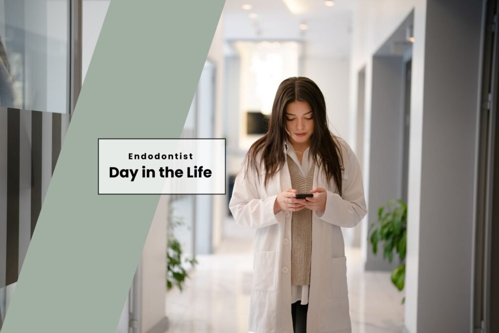 female endodontist walking down hallway in hospital clinic looking at iphone